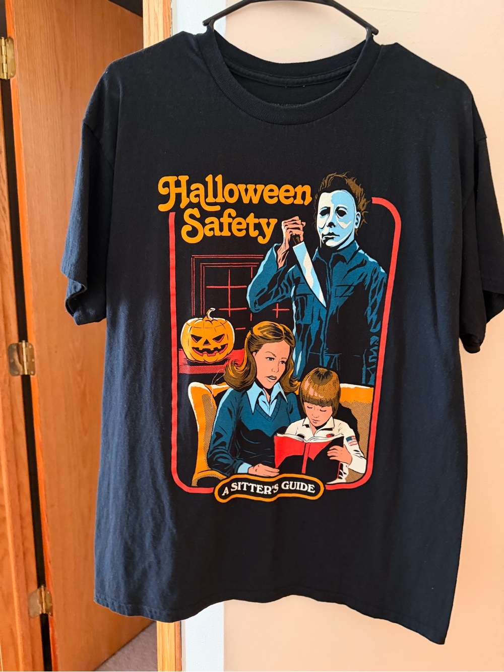 Spirit Halloween Safety Graphic Tee - Black with Orange, Blue and Yellow Print